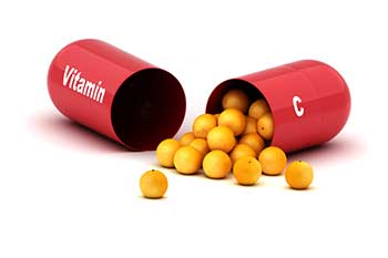 قرص ویتامین ث و پرتقال