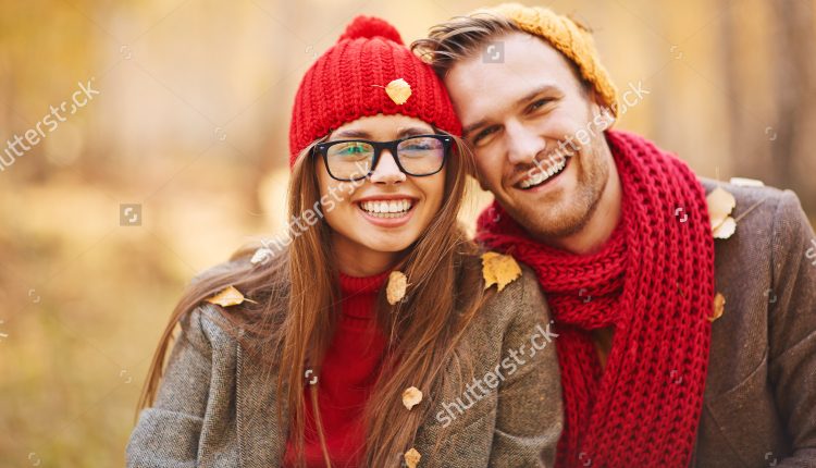 stock-photo-happy-young-couple-in-leaf-fall-enjoying-autumn-319933886