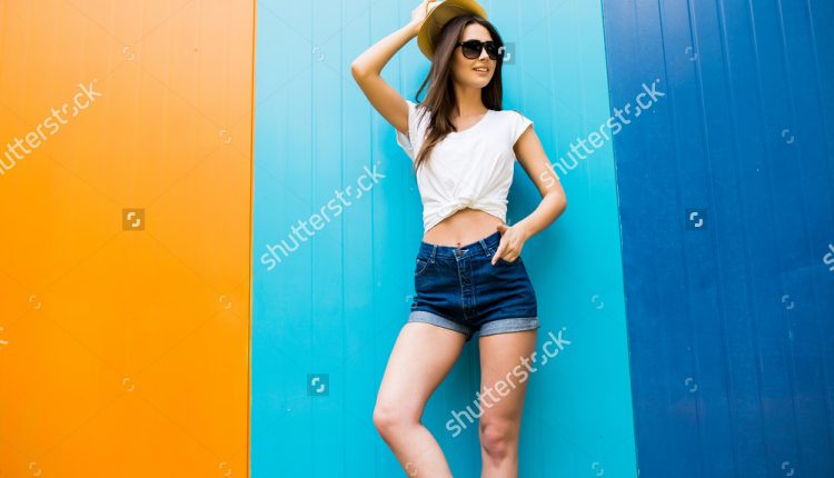 stock-photo-young-girl-against-color-wall-background-443611666